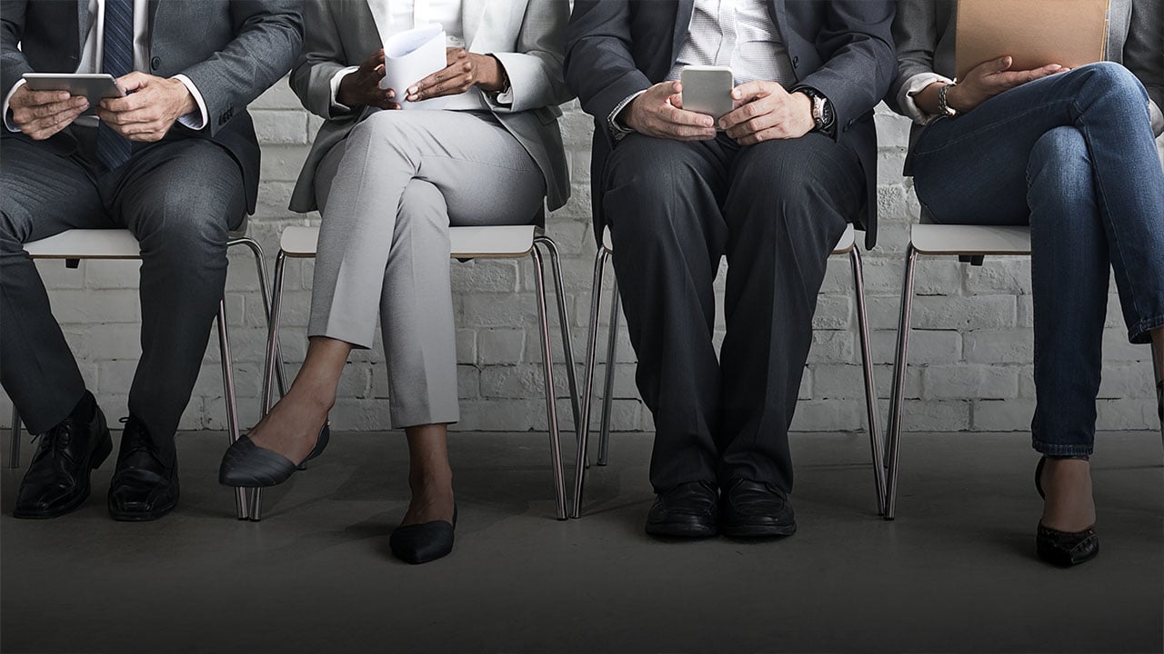 Candidates from direct sourcing methods wait in line for an interview.