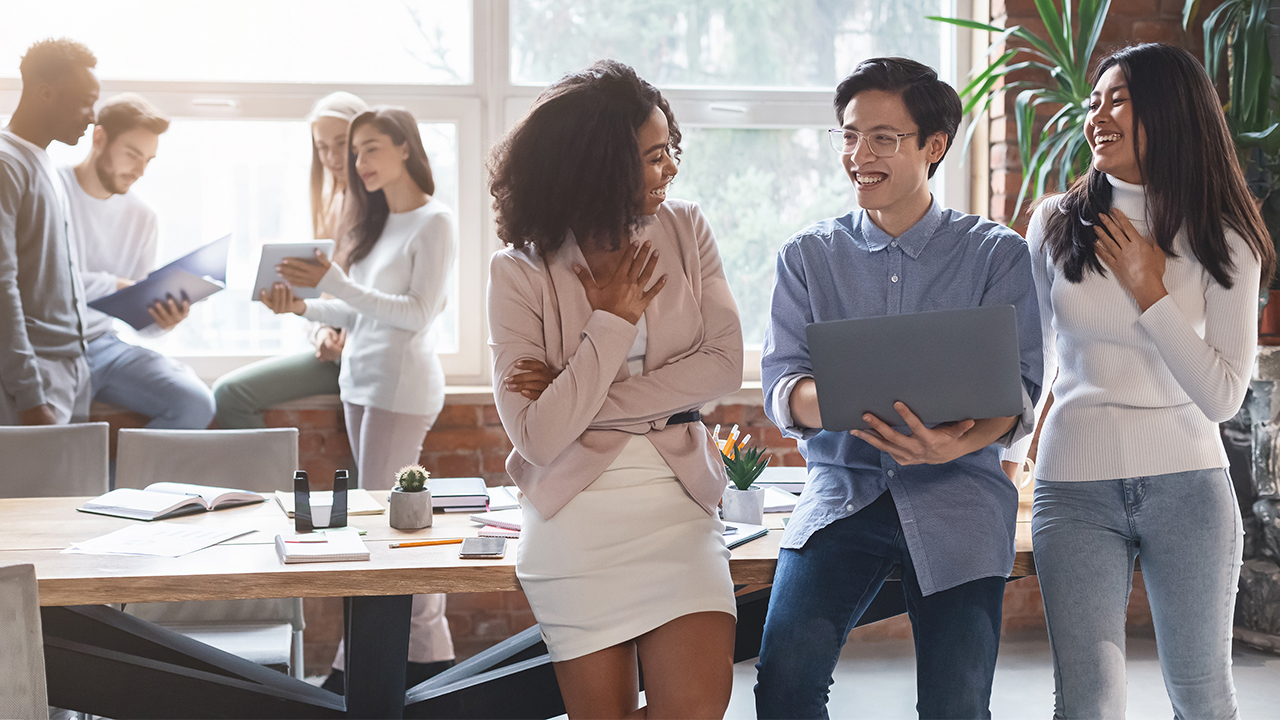 Multicultural employees discussing diversity in the workplace